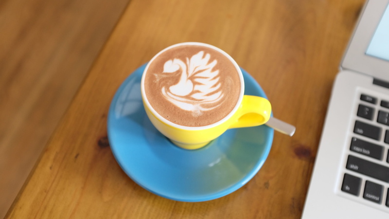 close-up, wood grain, cup, hot drink, cappuccino, coffee cup, food and drink, saucer, beverage, froth, teacup, crockery, drink, frothy drink, high angle view