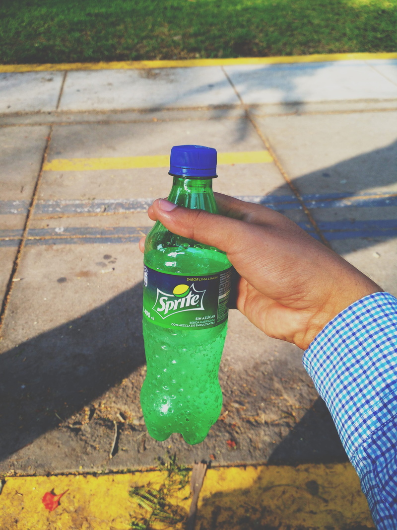 liquor, coffee cup, bottle, beer, sprite, wheel, unrecognizable person, beverage, human body part, shadow, 4K, finger, human, mineral water, green color