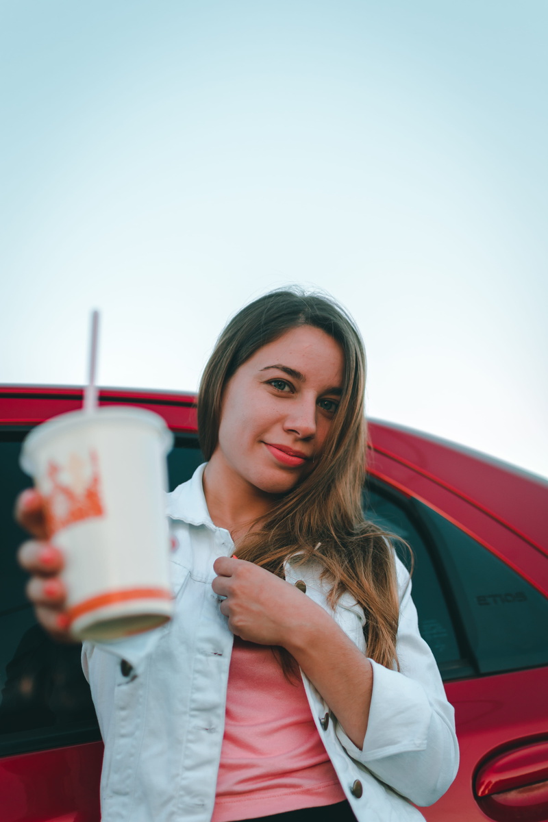 drinking, day, young women, jacket, drink, coffee cup, hair, one person, cup, tire, young adult, 5K, drinking straw, holding, soda, human, leisure activities