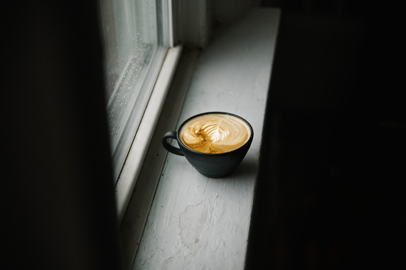 coin, cup, freshness, citrus fruit, beverage, bread, directly above, latte, bun, table, color, gold, cappuccino, food, finance, selective, indoors, coffee cup