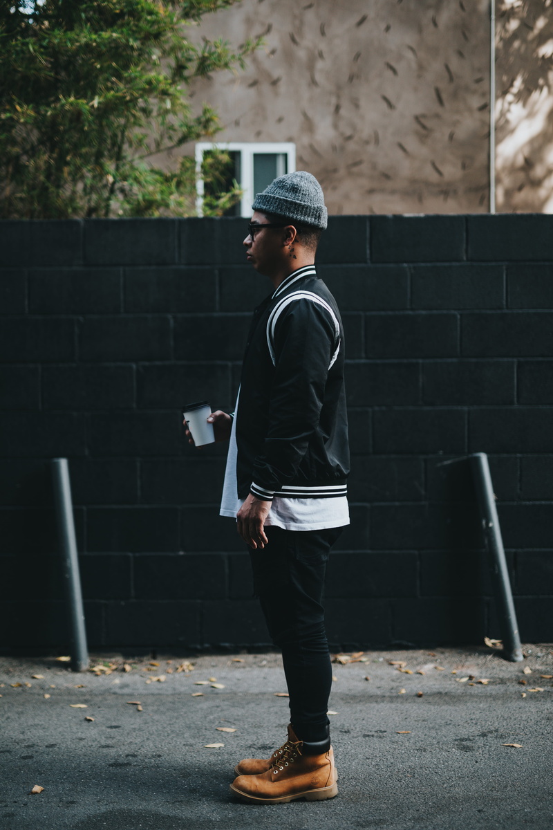 guy, 5K, men, full length, day, building exterior, brick, white, leisure activity, standing, black, wearing, built structure, architecture, near, coffee cup