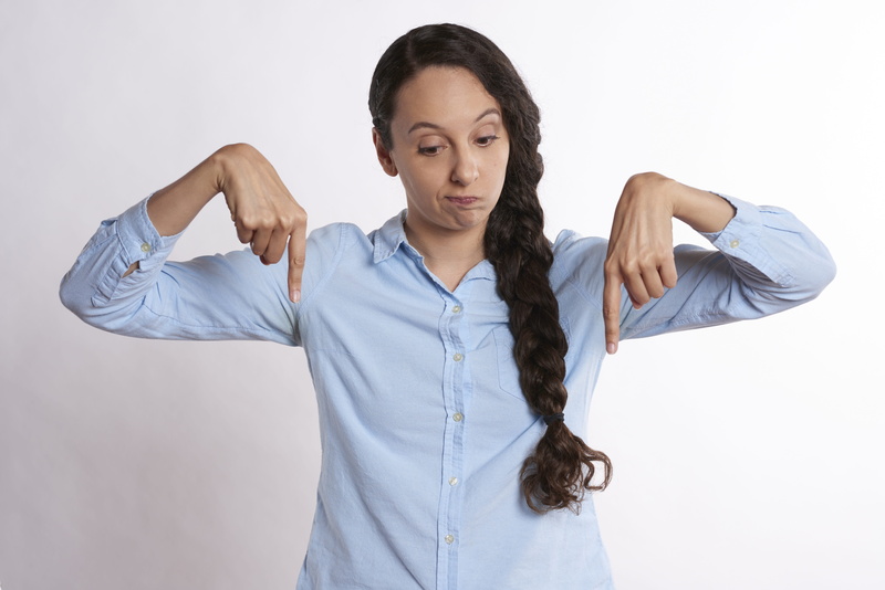 arms raised, pointer, businesswoman, down, looking, finger, bottom, one person, pointing, young women, human arm, portrait, adult, female, pointing down