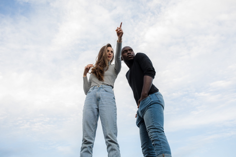 togetherness, photography, women, happiness, two people, arms raised, love, real people, pointing, near, finger, cloud - sky, african american, man, jeans
