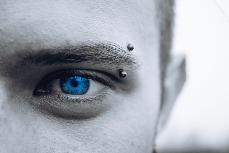 human face, grey, human, sensory perception, close-up, eyeball, men, adult, face, person, close up, hair, one person, photo, piercing, isolated color, eyebrow