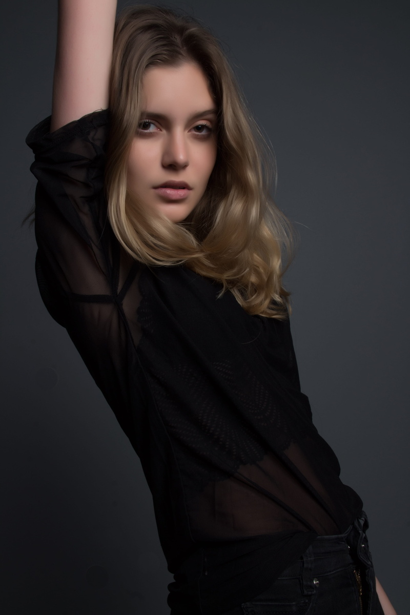 fashion, beauty, eye contact, arm raised, long hair, 5K, deep, pose, lace, lifestyles, shirt, black wear, young adult, studio shot, blouse, black, blonde hait
