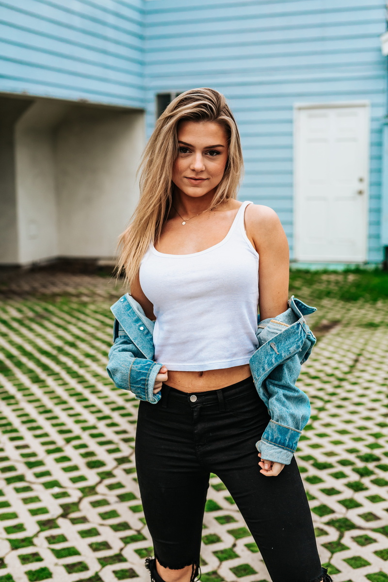 long hair, real people, young adult, hairstyle, woman, three quarter length, blonde hair, bottoms, black, outdoors, white, beauty, fashion, leisure activity