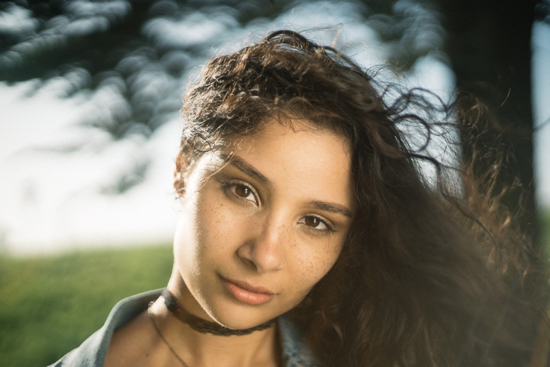 depth of field, girl, body part, s, beautiful woman, headshot, human, teenager, nature, palace of fine arts theatre, woman, looking at camera, focus on foreground