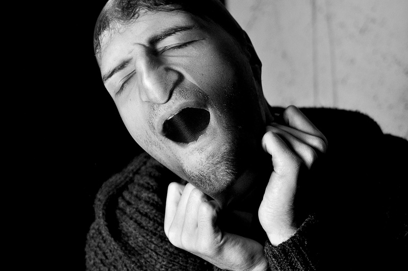 leisure activity, finger, photography, lifestyles, tribe, portrait, mime, human, covering, sweater, lip, beard, real people, black background, black, mouth