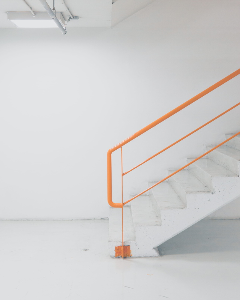 downstairs, stair, built structure, ground floor, stairs, railing, wall, emergency exit, ladder, colour, color, minimal, absence, orange, copy space, steps and staircases