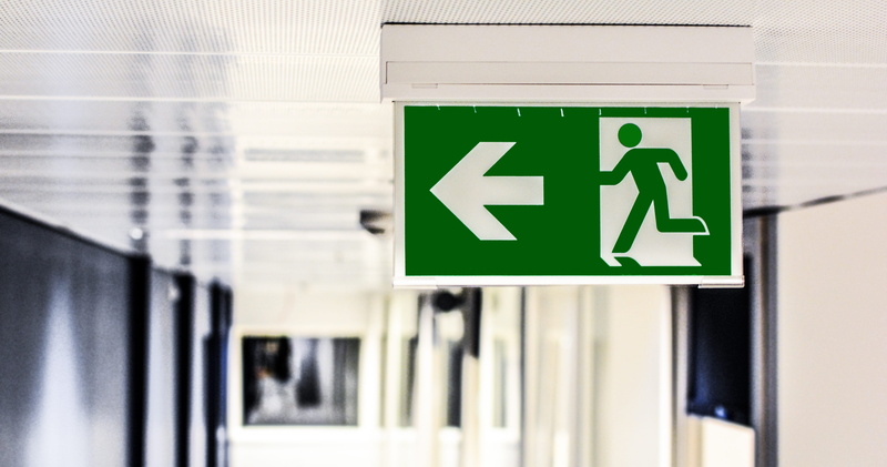 human representation, directional sign, no people, symbol, close-up, exit sign, law, male, guidance, safety, green, information sign, image, depth of field
