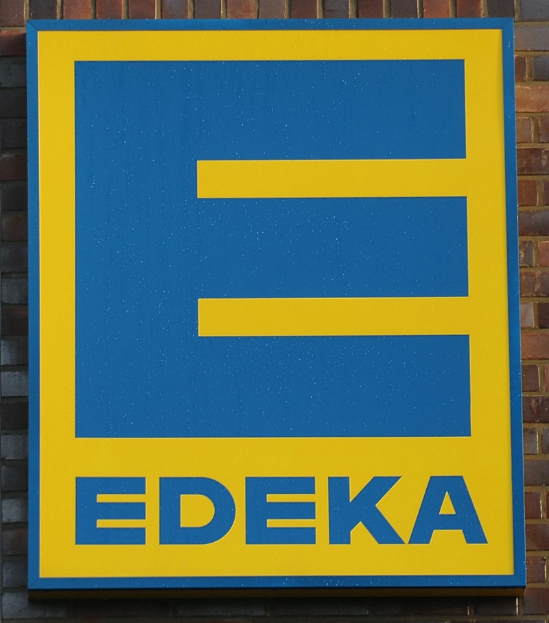 supermarket, text, road, logo, non-western script, message, no people, emergency exit, shield, arrow symbol, sign, capital letter, blue, day, edeka, communication
