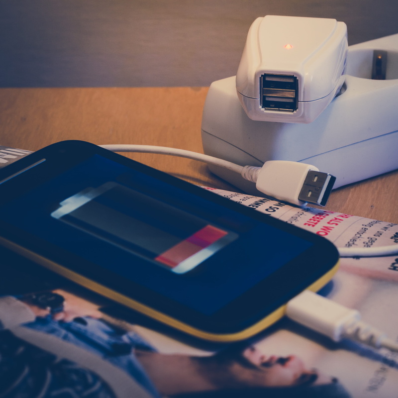 indoors, high angle view, battery, wireless technology, portable information device, table, 2K, telephone, still life, connection, paper, technology, wood - material