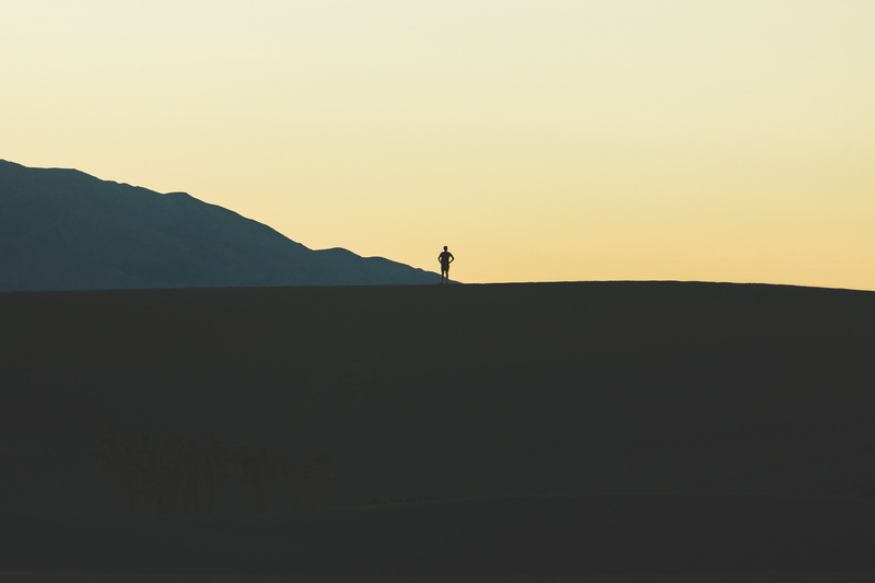 sunset, one person, outdoors, nature, mountains, mountain, sky, black, beauty in nature, lifestyles, real people, landscape, bed, standing, land, tranquility