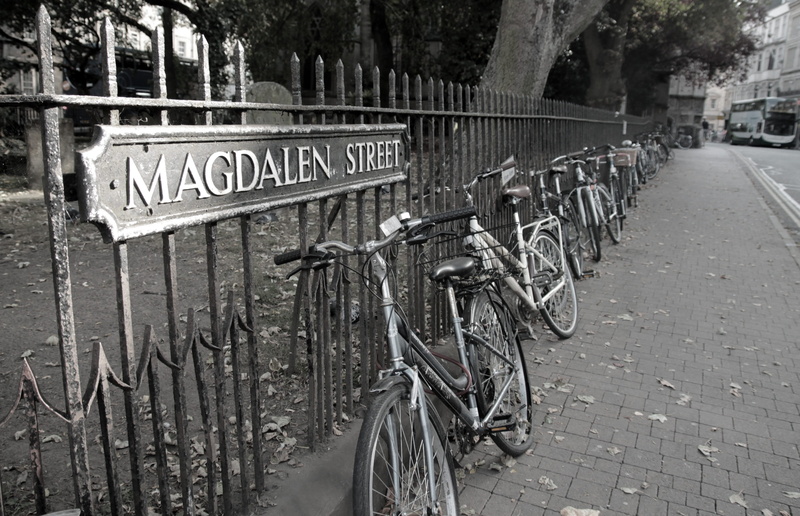 mode of transportation, british, architecture, sidewalk, stationary, non-western script, no people, britain, bicycle, outdoors, fence, footpath, information