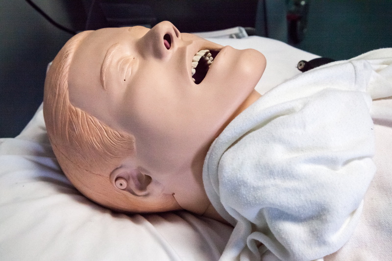 education, mouth open, eyes closed, relaxation, adult, male, lying on back, paramedics doll, rescue, emergency, medical, patient, doctor, health, assistance