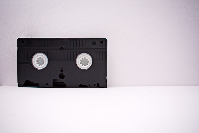 video recording, surface, vhs, cut out, videotape, power supply, no people, wooden, audio equipment, equipment, electrical equipment, wall - building feature