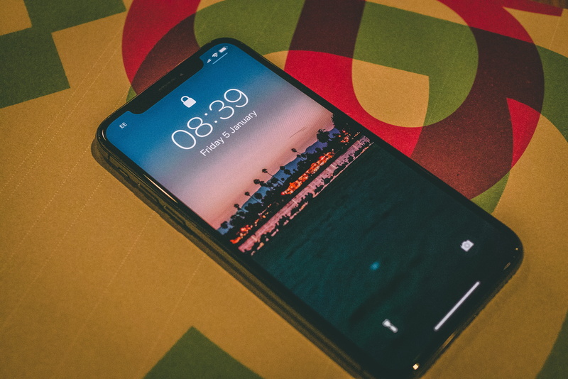 text, no people, equipment, multi colored, number, wireless technology, beach, western script, connection, space grey, technology, apple, green color, tech