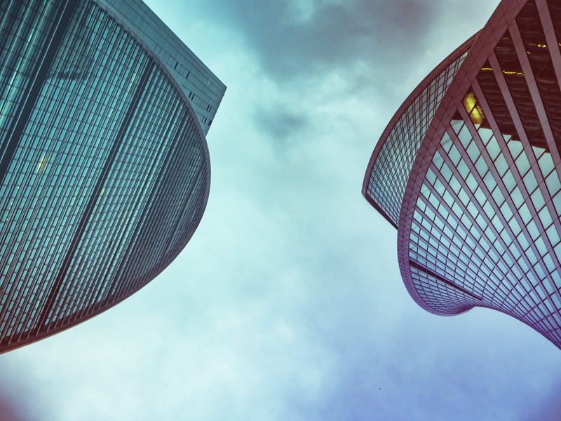 city, urban, offices, tall - high, blue, design, outdoors, buildings, no people, structures, architectural design, sky, low angle view, architecture, scene