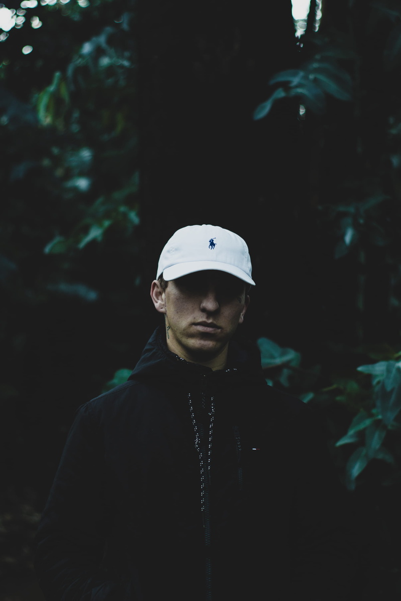 real people, portrait, young, male, jacket, hat, tattoo, young men, mid adult, lifestyles, standing, polo, leisure activity, green contrast, 2K, serious