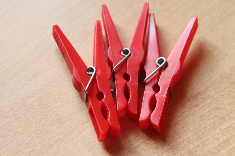 indoors, two objects, no people, group of objects, creativity, red, clothespins, scissors, office supply, art and craft, focus on foreground, close-up