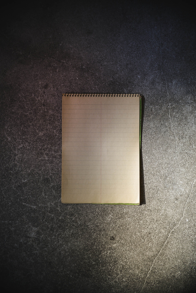 wall - building feature, mockup, paper, empty, wood - material, communication, single object, scratchpad, dirt, book, flooring, no people, publication