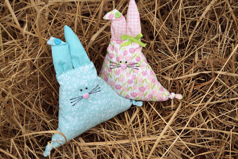easter figures, stuffed animals, figures, field, happy easter, nature, animal representation, representation, pillow, pink color, easter, land, grass, sewn