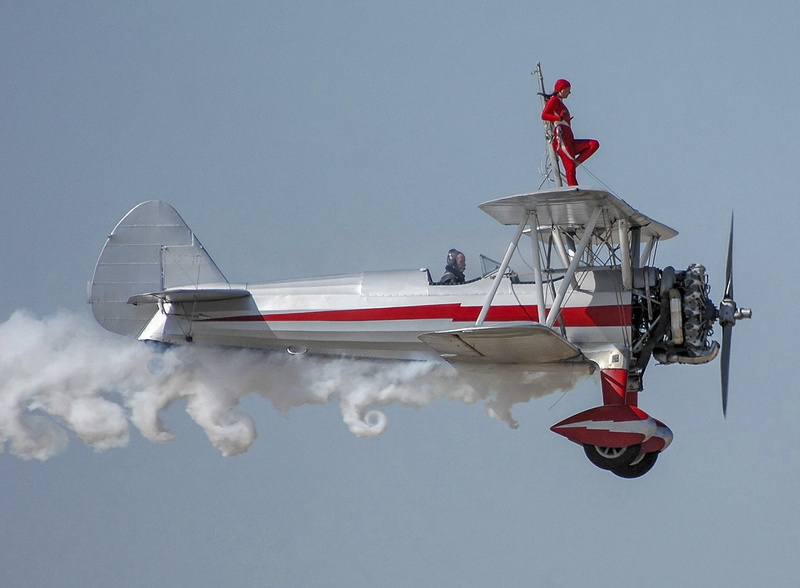 clear sky, plane, clouds, no people, mode of transportation, rescue worker, wing walker, flying, transportation, wing, aviation, nature, airshow, sunny
