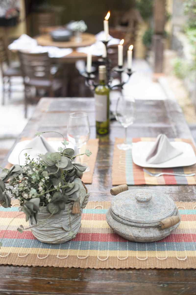 restaurant, wood - material, table, pot, setting, plate, blurred background, day, dining, food, cooking, candles, flowers, plant, place setting, focus