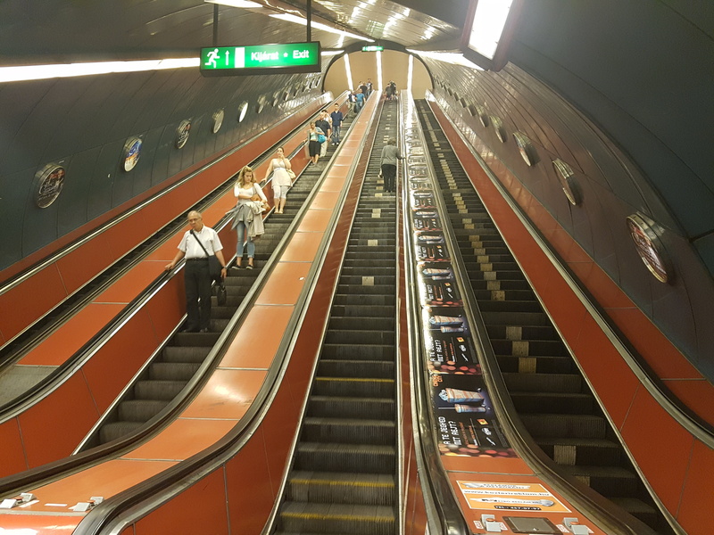 escalator, real people, illuminated, subway station, rail transportation, adult, means of rail transport, track, diminishing perspective, hungary, moving walkway