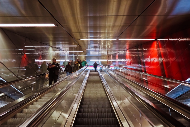 metro, on the move, movement, within, terminal, illuminated, group of people, railway station, built structure, direction, modern, moving walkway, railing