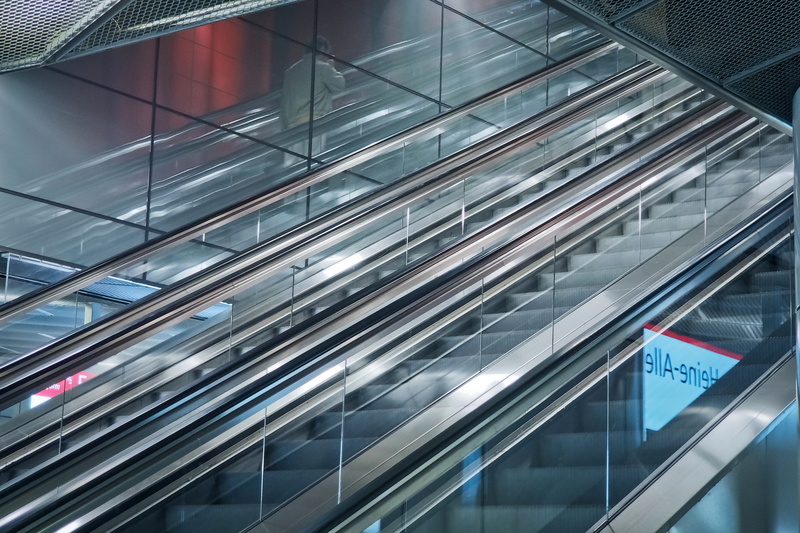 gradually, indoors, transportation, elevator, convenience, business, steps and staircases, built structure, motion, metro station, steep, silver colored