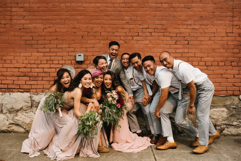 smiling, brick, adult, standing, wall, men, caucasian Ethnicity, brown, front, full length, group Of People, flower, women, happiness, concrete, males