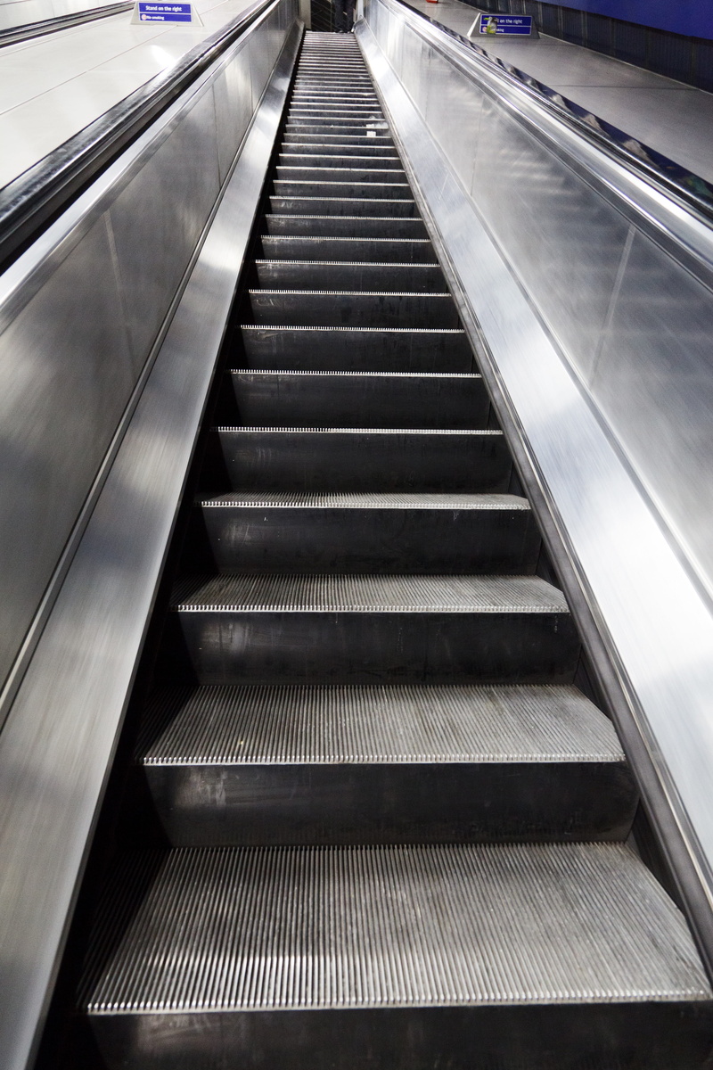 moving walkway, direction, convenience, metal, steps and staircases, railing, transport, black, steel, illuminated, step, transportation, low angle view