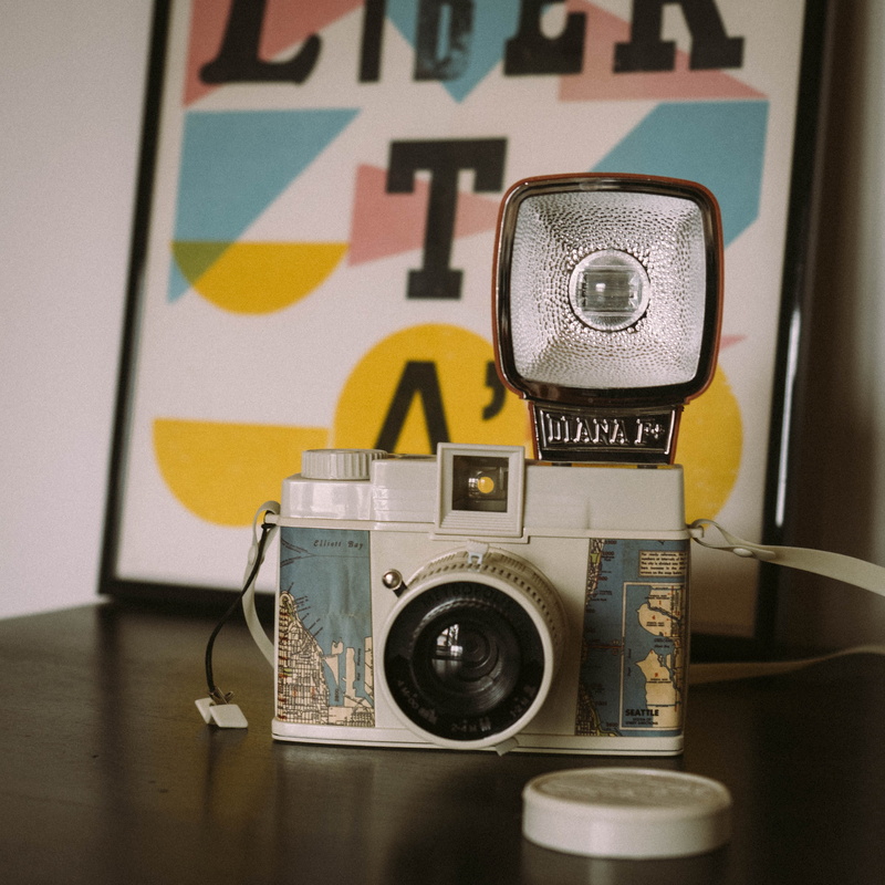 photographic equipment, blue, toycamera, libertà, close-up, typography, flash, technology, dianaf+, creativity, diana, toy, table, design, still life, white