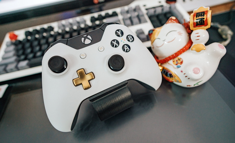 close-up, white, relaxation, equipment, ceramic, indoors, multicolored, xbox, luck, no people, figurine, toy, beside, business, keyboard, one, plastic