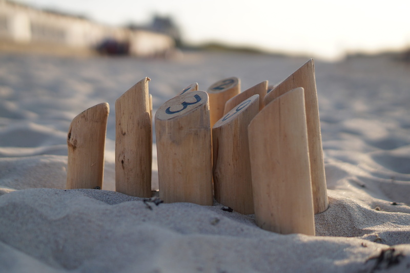 sunlight, land, beauty in nature, france, water, focus on foreground, wood, selective focus, beach, ink, tranquility, creativity, game, sand, day, wood - material