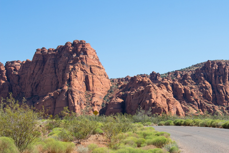 travel destinations, mountain range, sky, tranquil scene, rock, land, physical geography, clear sky, environment, mountain, green, rock - object, eroded