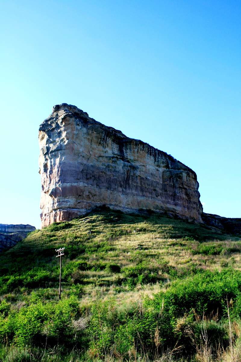 day, grass, Stand Alone, low angle view, mountain, blue, flat topped, slim, non-urban scene, layered sandstone, field, plant, scenics - nature, green grass