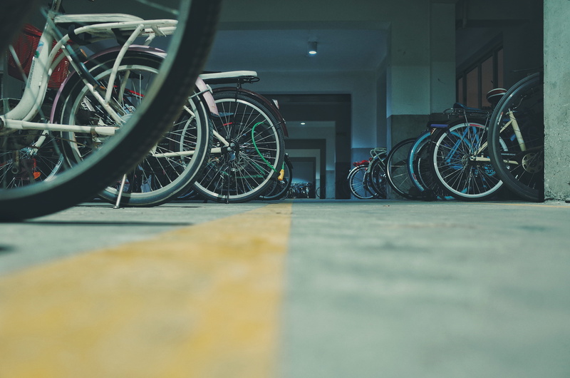 car, bike, bicycle, outdoors, flooring, sports, spoke, automobile, furniture, wheel, surface level, city, wheelchair, mode of transportation, land vehicle
