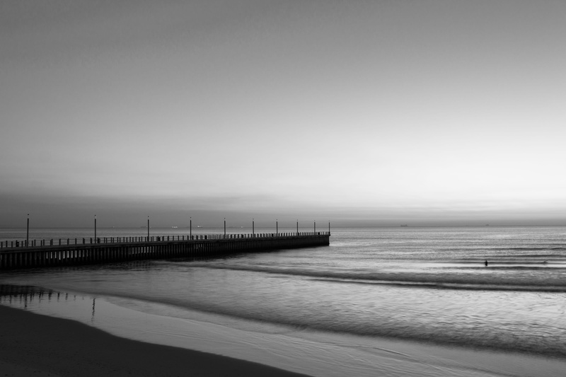 north pier, durban, water, non-urban scene, sea, darrel collins, south africa, sand, horizon, black and white photography, sky, ocean, outdoors, day, clear sky