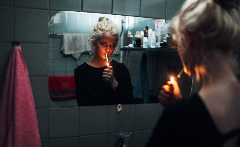 red lipstick, lifestyles, smoking, home, black clothing, cigars, illuminated, headshot, blond hair, waist up, photography, face, adult, blonde, bathroom