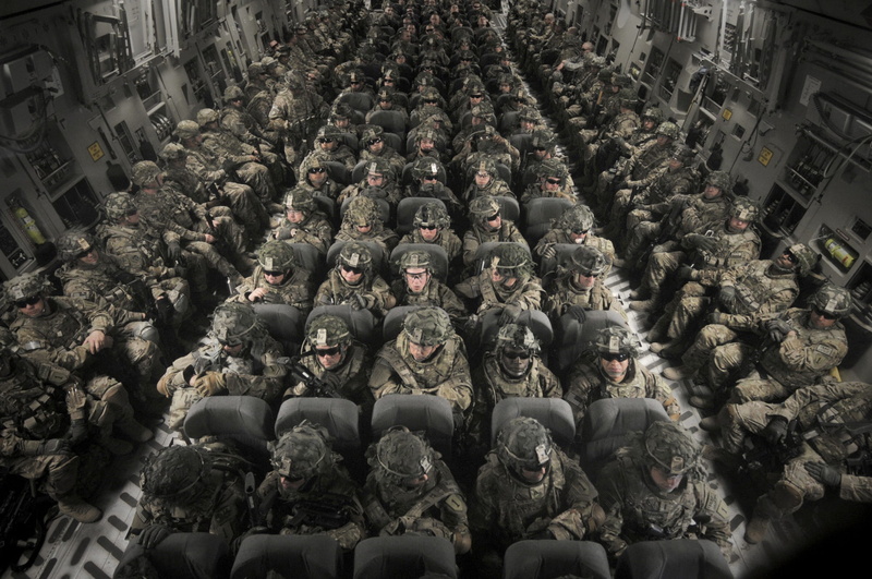 large group of people, women, in a row, built structure, abundance, riding, transportation, army, plane, aircraft, celebration, group of people, jet, day