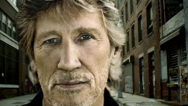 facial hair, real people, front view, man, city, adult, one person, s, close-up, built structure, looking at camera, houses, focus on foreground, building exterior