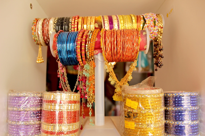 for sale, hindu, clothing, 5K, no people, indian bracelets, sale, jewelry, gold, arabian, consumerism, retail, gold colored, retail display, person, fashion