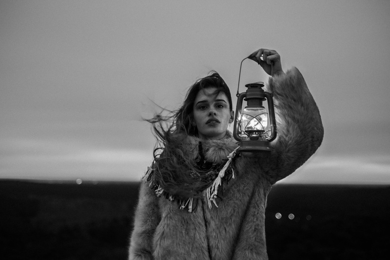 nature, windy, photography, fur, hairstyle, wind blown, warm clothing, woman, outdoor, dark, noir et blanc, monochrome, girl, sky, casual clothing, one person
