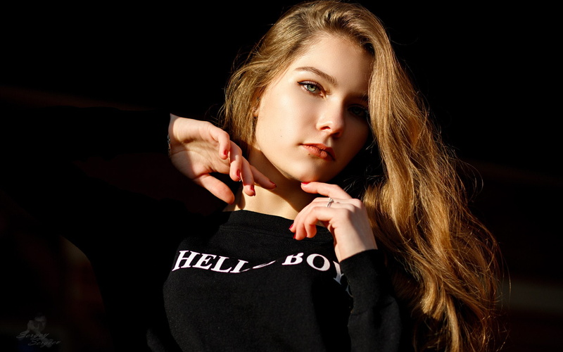 green eyes, young women, indoors, Sergey Sergeev, face, blond hair, 1080P, red nails, one person, black background, studio shot, casual clothing, headshot