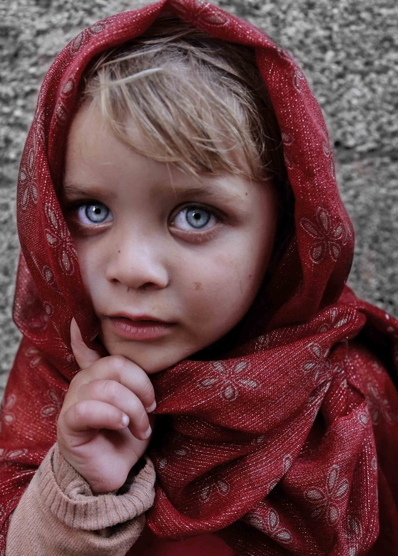 red, child, leisure activity, face, portrait, human face, eyes, headshot, real people, one person, front view, childhood, alleys, blue eyes, looking at camera