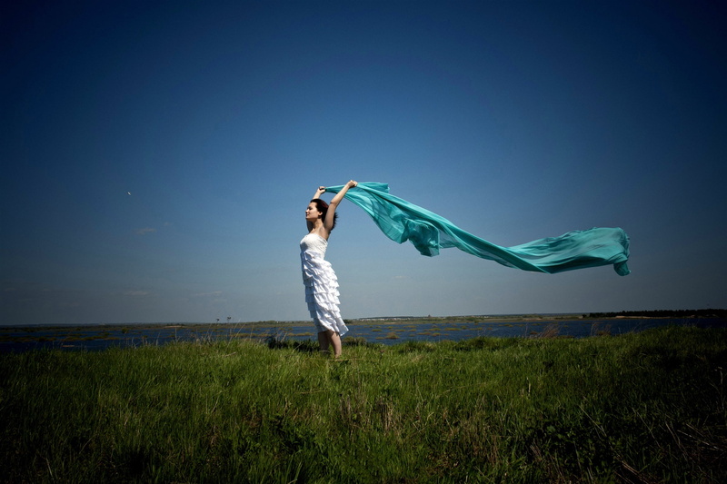 land, outdoors, casual clothing, standing, field, SHAWL, 1080P, DRESS, GRASS, limb, SPACE, human limb, GREEN, HORIZON, s, blue, green color, arms raised