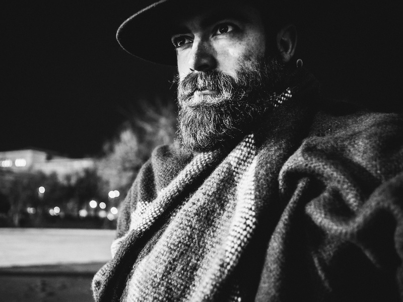 warm clothing, wearing, looking, mammal, adults only, outdoors, dog, serious, men, senior Adult, grayscale, clothing, 5K, cap, adult, casual clothing