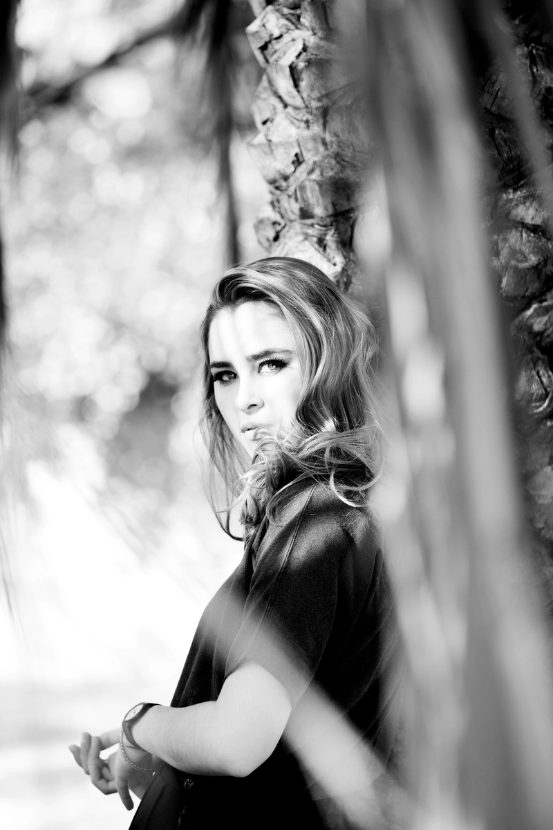 person, photoshoot, girl, plant, lady, makeup, hairstyle, skin, female, blurred background, beautiful, leaning, looking at camera, model, close-up, lips
